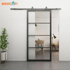 Puertas de vidrio con estructura metálica y vidrio templado transparente con puerta corrediza