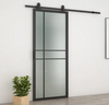 Moderna puerta corrediza de vidrio con marco de acero negro y herrajes
