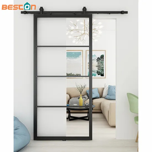 Puerta de granero estilo loft de vidrio transparente con marco de acero negro y herrajes corredizos