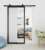 Puerta interior de una pieza con marco de acero negro para apartamento con inserto de vidrio transparente